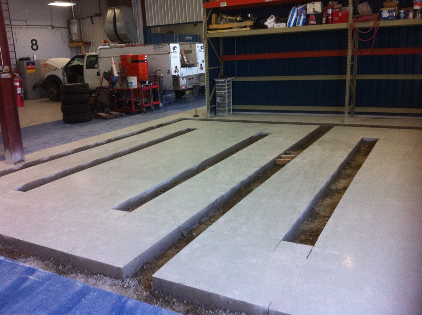 Precision floor saw cuts in commercial auto shop — Concrete Cutting Geeks Calgary