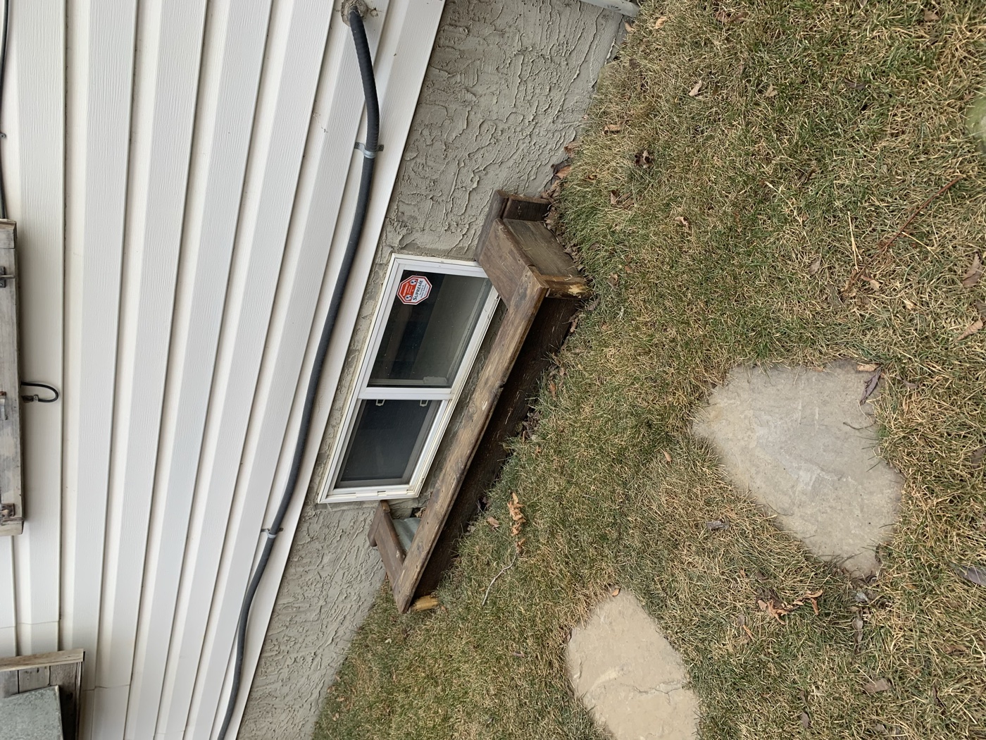 Existing non-egress basement windows before replacement — Calgary