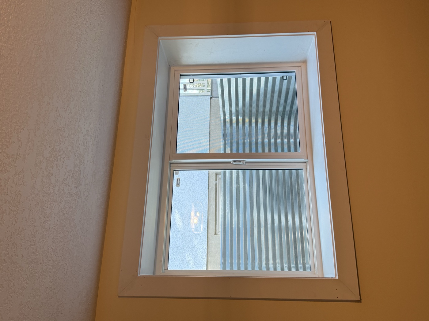 Interior finishing complete on egress window — Calgary basement bedroom