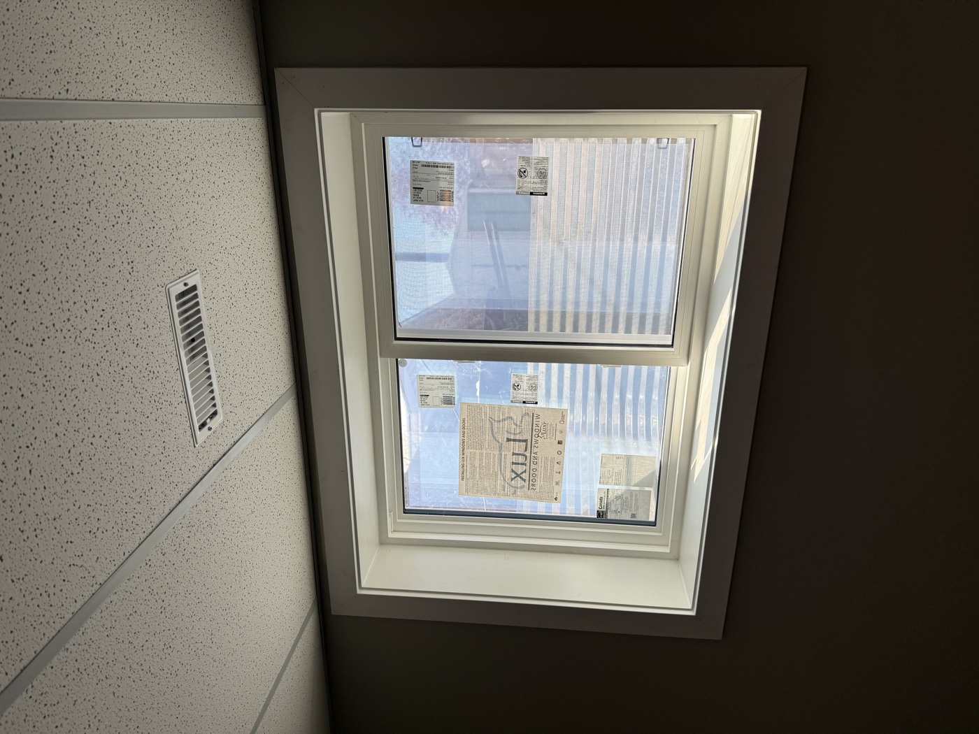 White melamine interior window finishing — egress upgrade Calgary