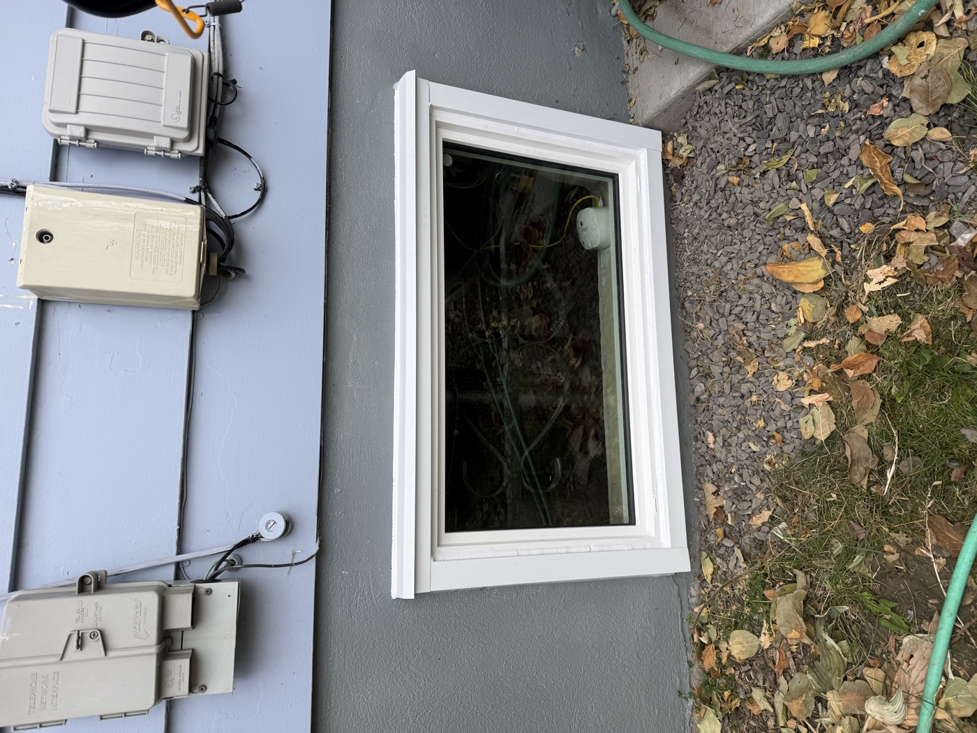 Non-egress small basement window placement — does not meet Calgary egress code