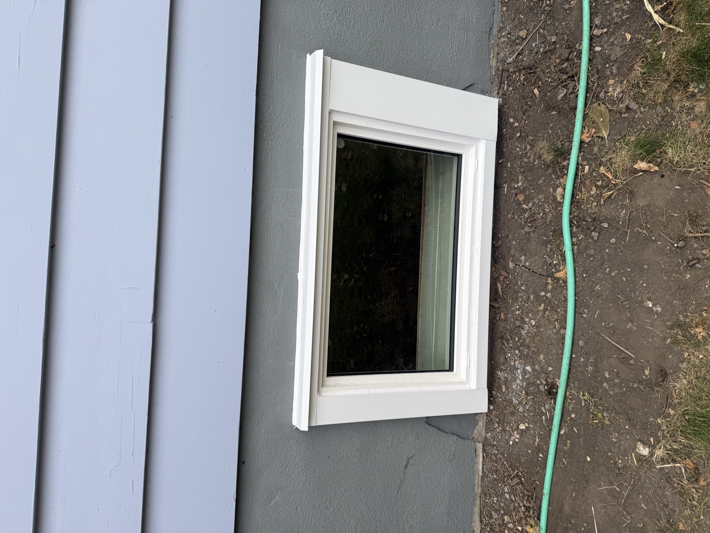 Non-egress window in Calgary basement — too small for emergency exit compliance